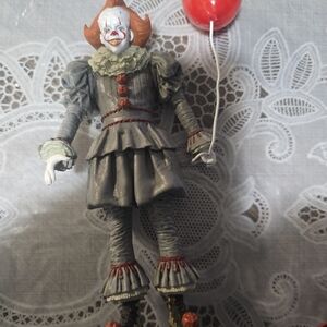 Gray and Red Clown Figure with BalloonUltimate Pennywise figure produced WBEI